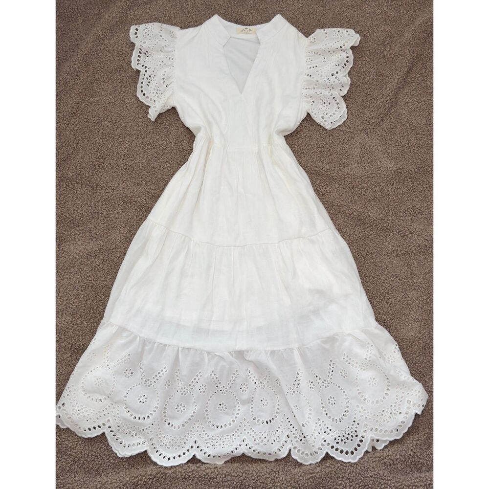 White eyelet midi dress with flutter sleeve, fitted waist, embroidered hem